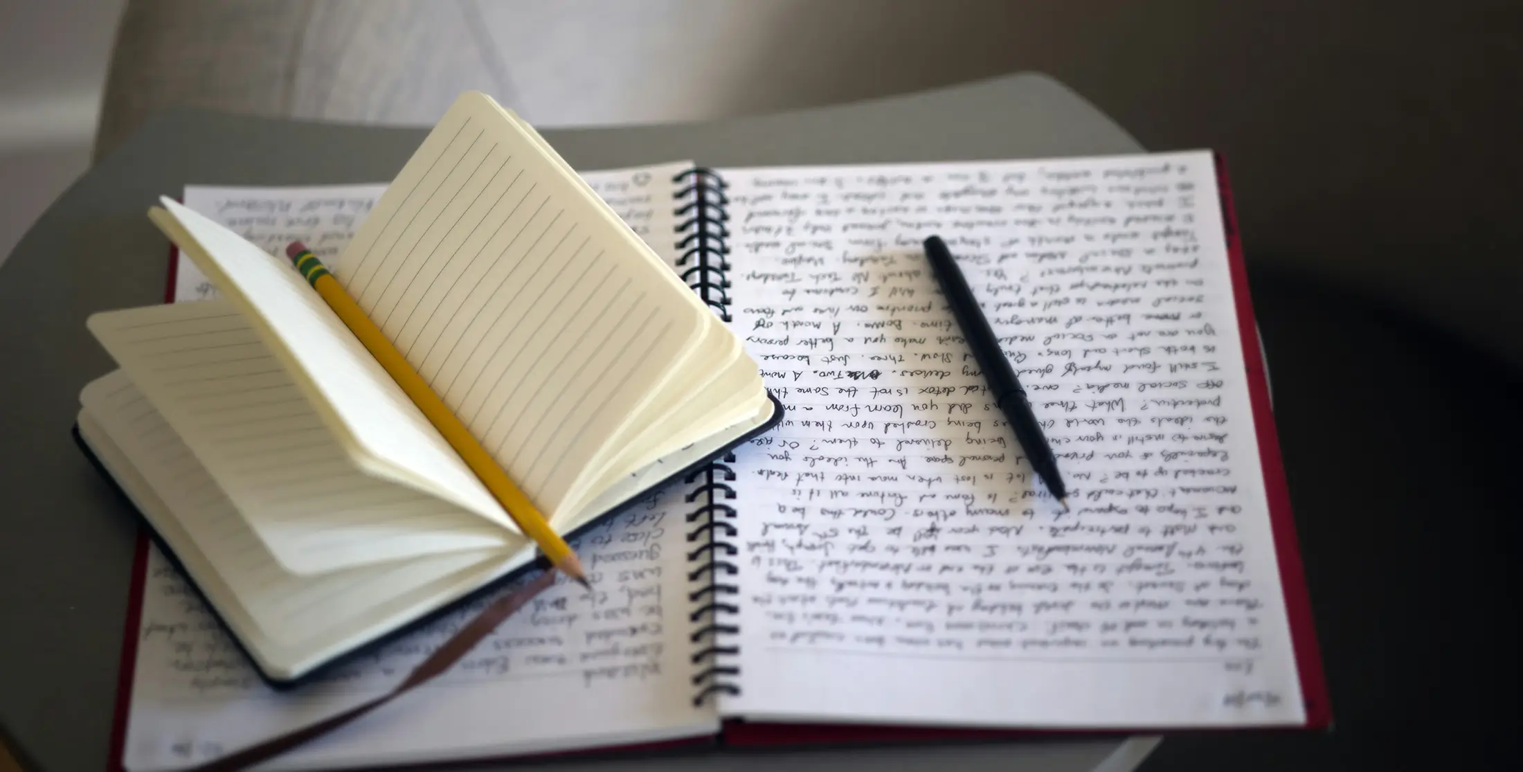 a notebook filled with handwritten paragraphs